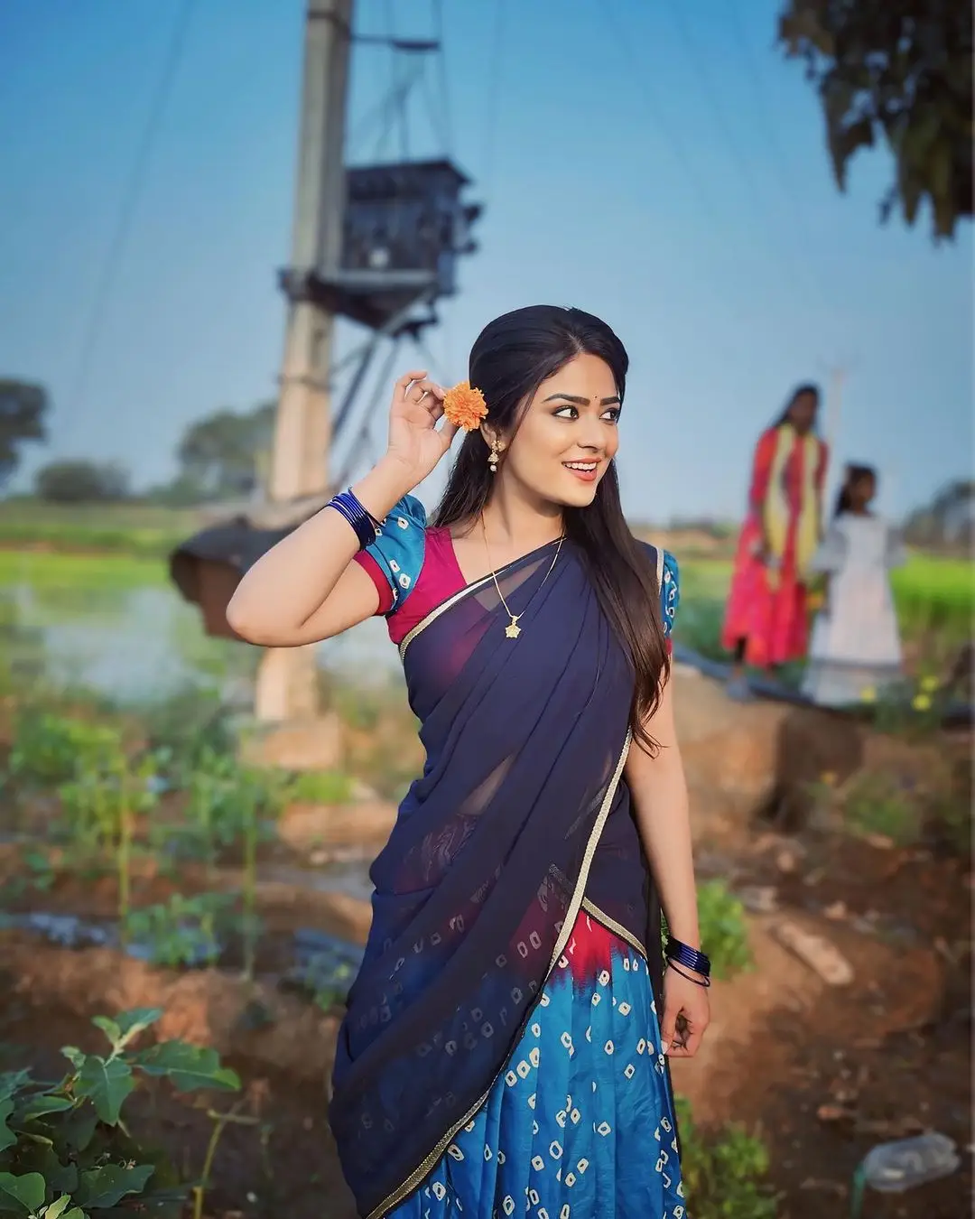 Priyanka Sharma Stills In Blue Saree Sleeveless Blouse